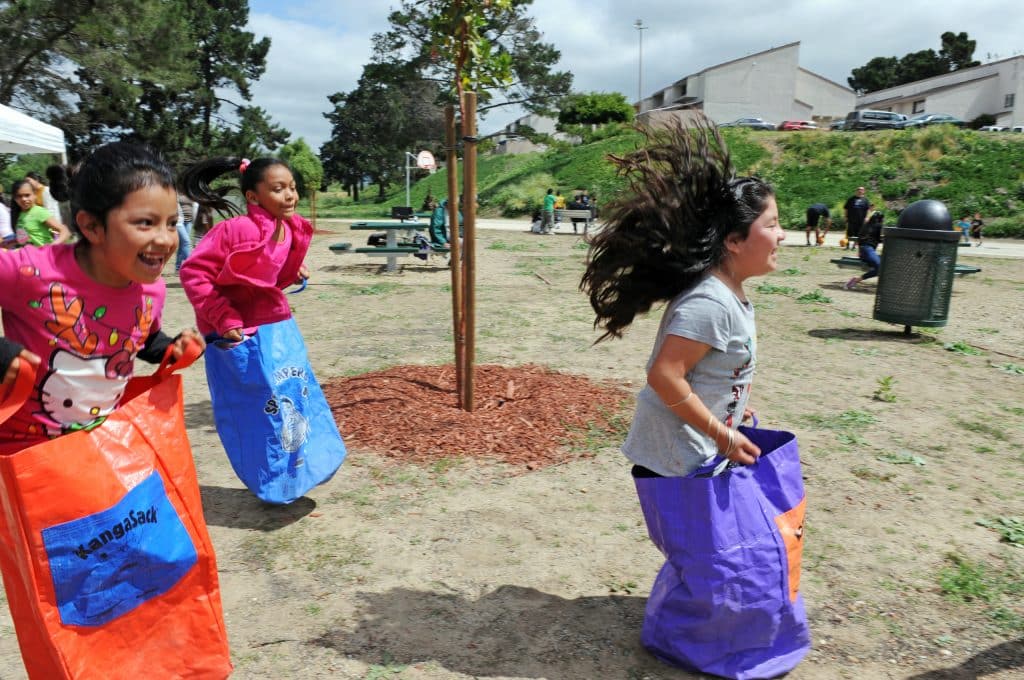 Children participate in a sack race at the opening on Sunday, April 24th, 2016 of the new Acosta Plaza Recreation Area in east Salinas, CA.
Acosta Plaza Recreation Area
United States, California, Monterey County, Salinas, Monterey, Jay Dunn, photographer, freelance, photography, multimedia, video, photojournalism, www.jaydunn.org, jay@jaydunn.com, Acosta Plaza, Alisal, The Packard Foundation, recreation, health, community organizing, outdoor activities, parks, basketball, outside