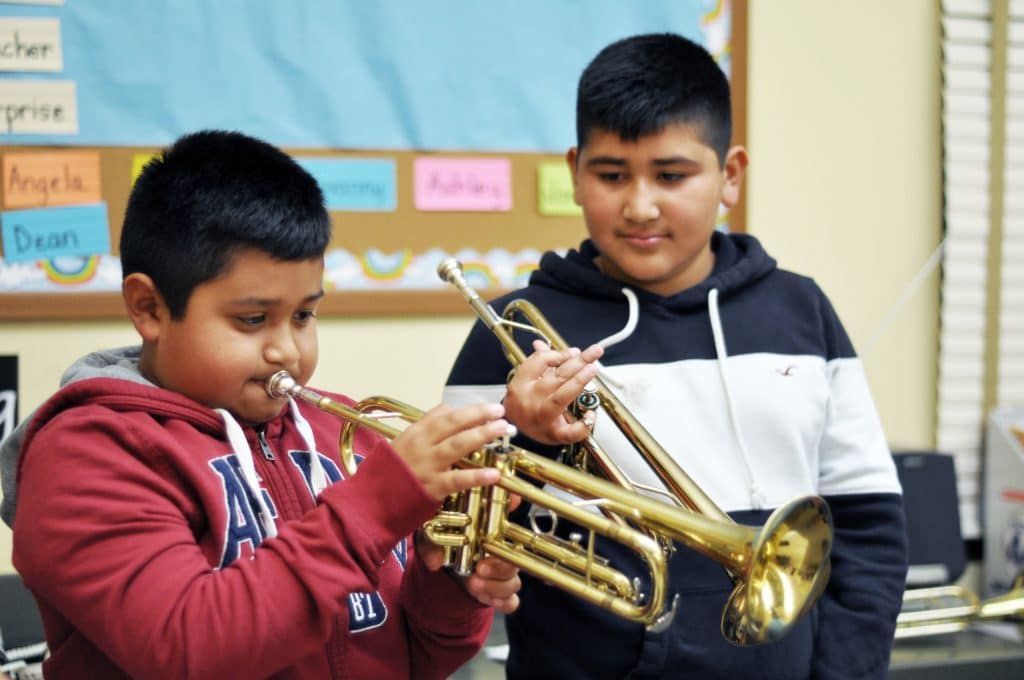 Ignacio Becerra, right, appreciates what Angel Contreras is playing in an ACAN class at Jesse Sanchez Elementary School in east Salinas. (c)Jay_Dunn_1_773_817_0547